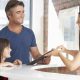 Father and Daughter at Dental Reception Desk